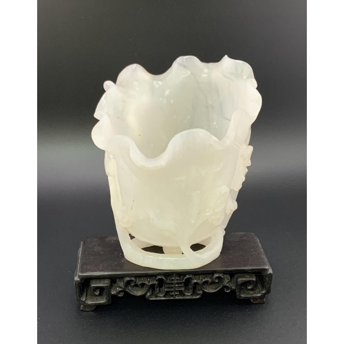 912 - A Chinese carved white jade vase In furled lotus leaf form with ruyi and vine decoration, 10cm toget... 