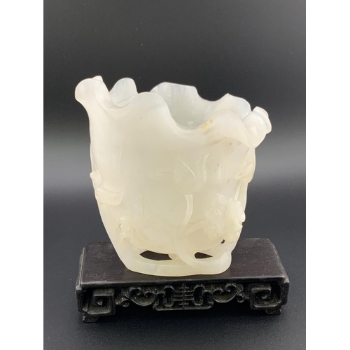 912 - A Chinese carved white jade vase In furled lotus leaf form with ruyi and vine decoration, 10cm toget... 