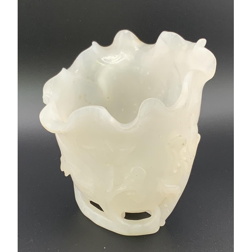 912 - A Chinese carved white jade vase In furled lotus leaf form with ruyi and vine decoration, 10cm toget... 