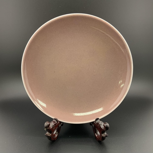 914 - A Chinese monochrome porcelain dish with an under glazed six character mark to base. 15.6cm