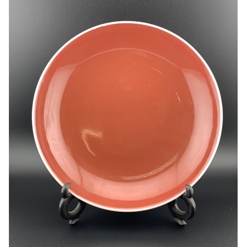 915 - A Chinese Oxblood red monochrome porcelain dish. 17.5cm. (D)