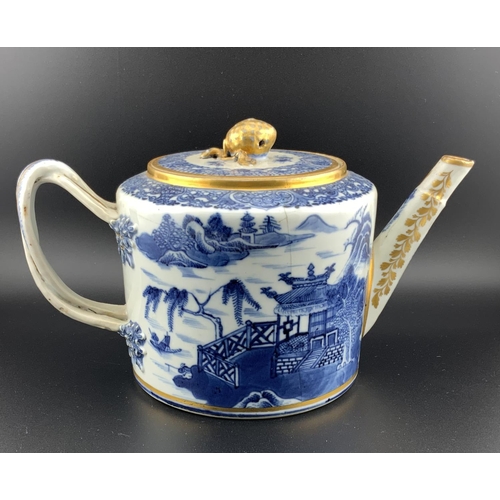 919 - A 19thC Chinese export porcelain teapot with gilt decoration, (hairline to body). H.13cm x 21cm x 12... 