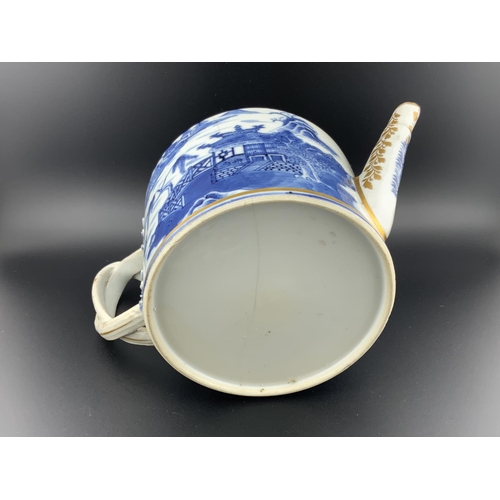 919 - A 19thC Chinese export porcelain teapot with gilt decoration, (hairline to body). H.13cm x 21cm x 12... 