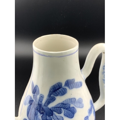 926 - A Chinese blue and white porcelain teapot with a water dropper style spout, underglazes flower mark ... 