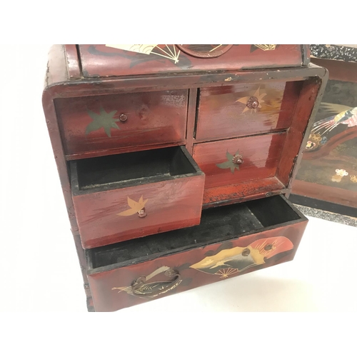 946 - Vintage Japanese decorated tray and a lacquered small table cabinet with six drawers.