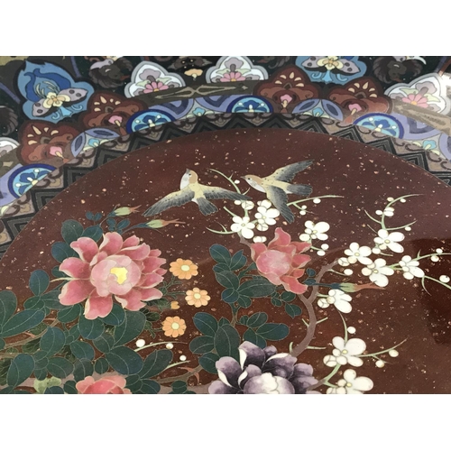 957 - A Chinese cloisonnÃÂ© charger the central design with birds and flowers. 44 cm .