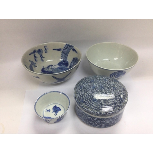 960 - Four blue and white china items comprising three bowls and a circular pot and cover, largest bowl di... 