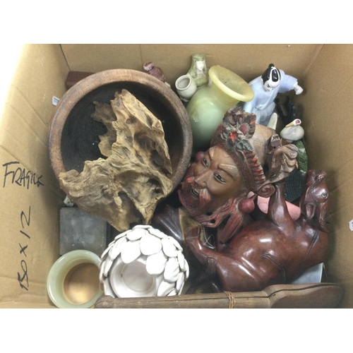 966 - A box containing various Oriental items including wood carvings, ceramic figures etc.