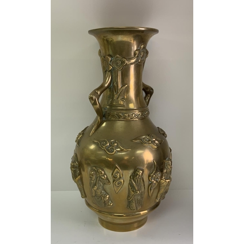 971 - A 19th century Chinese cast bronze vase surrounded by 8 images of immortals. 39cm.