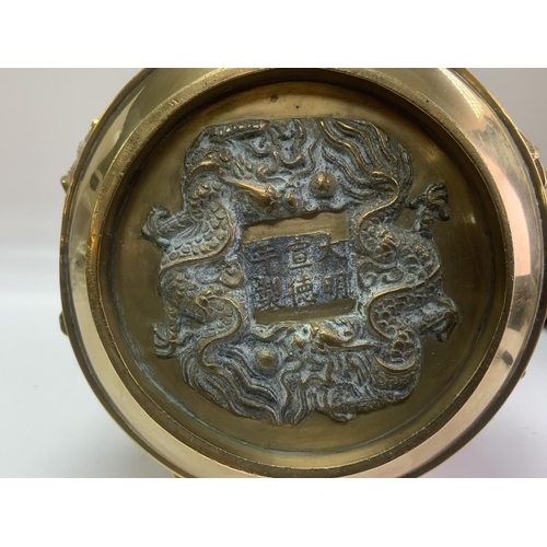 971 - A 19th century Chinese cast bronze vase surrounded by 8 images of immortals. 39cm.