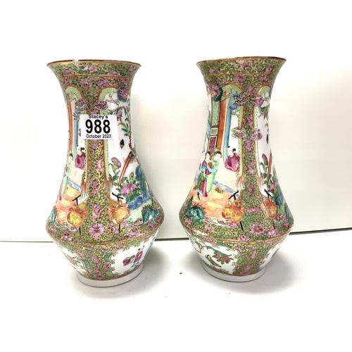 988 - A pair of Cantonese porcelain baluster shaped vases. 25cm (D) some damage to rim.