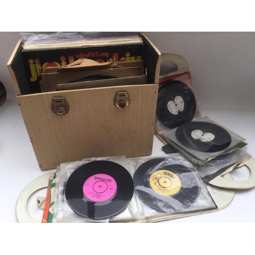 107 - Two vintage albums of 7inch singles by various artists together with a record case of LPs and 78s.