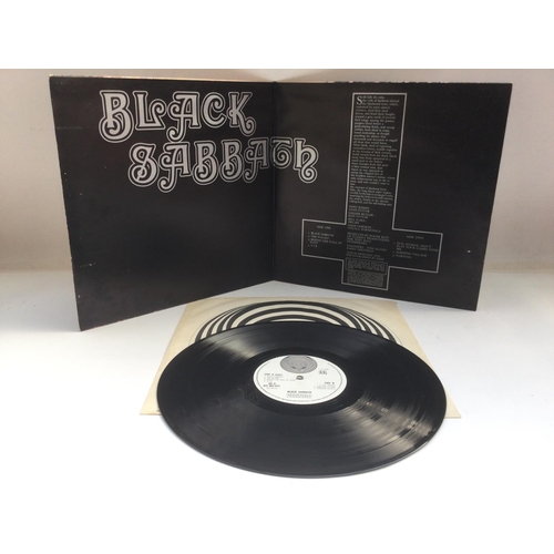 11 - An early UK pressing of the self titled debut LP by Black Sabbath with original Vertigo swirl inner.... 