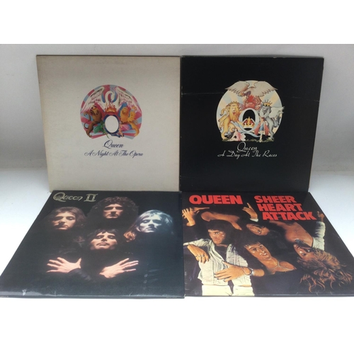 112 - Four early UK pressings of Queen LPs comprising 'A Night At The Opera', 'A Day At The Races', 'Queen... 