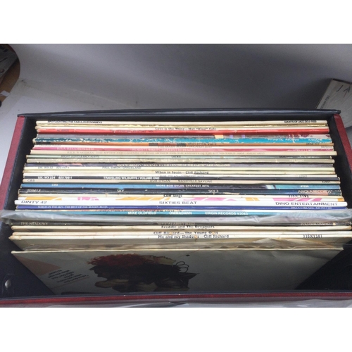 130 - A record case LPs and 12inch singles by various artists including Queen, The Stranglers, Traveling W... 