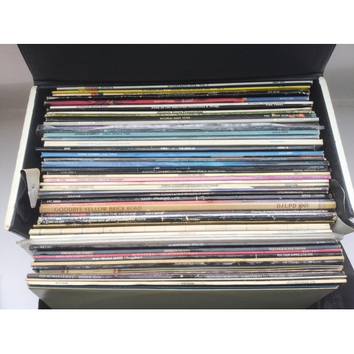 34 - A record case and a bag of LPs by various artists including Pink Floyd, The Who, Elton John and othe... 