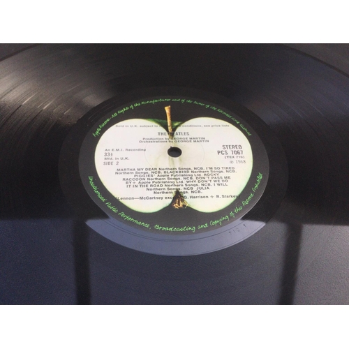 8 - A numbered Beatles 'White Album' 0574739 with black inners and poster but no portraits. Vinyl in Ex ... 