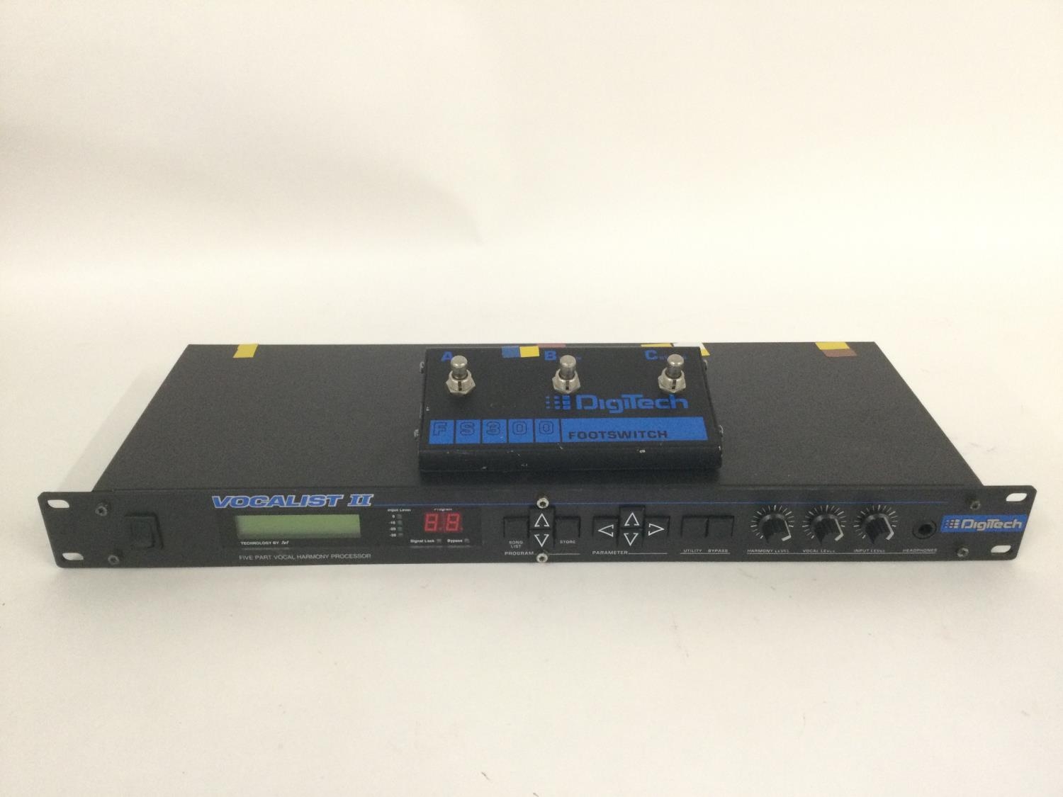 A Digitech Vocalist II vocal processor with footswitch and manual.