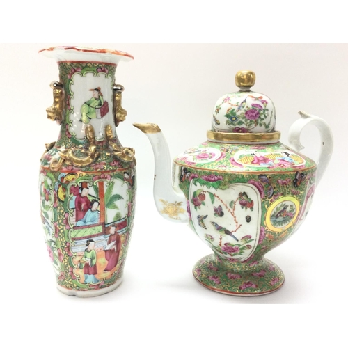 1111 - A Cantonese Famille Rose tea pot and vase. Chips at the rim of the vase and at the base. Approximate... 