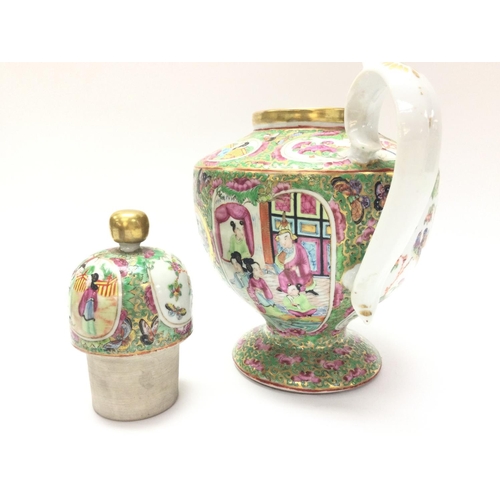 1111 - A Cantonese Famille Rose tea pot and vase. Chips at the rim of the vase and at the base. Approximate... 