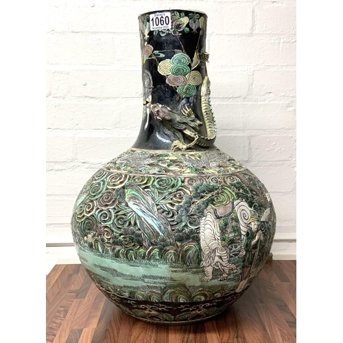 1113 - A large Chinese Famille Noir Ling-lung (devils work) pierced decoration bottle vase, please note thi... 