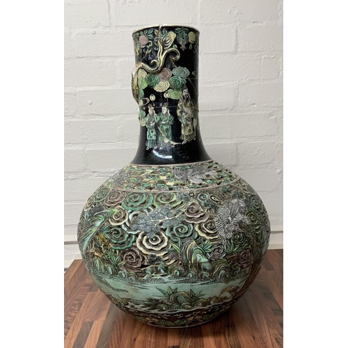 1113 - A large Chinese Famille Noir Ling-lung (devils work) pierced decoration bottle vase, please note thi... 