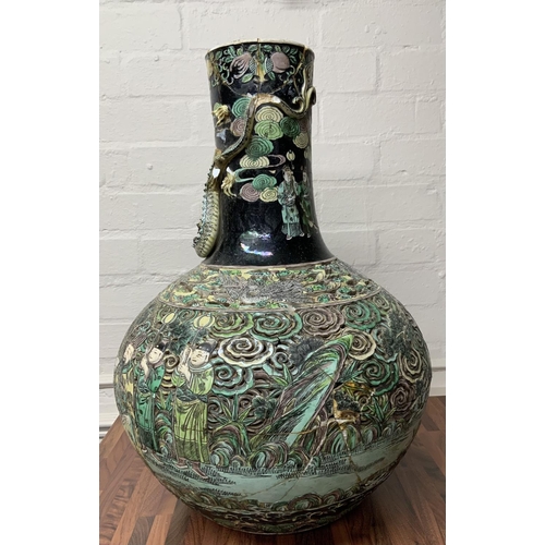 1113 - A large Chinese Famille Noir Ling-lung (devils work) pierced decoration bottle vase, please note thi... 