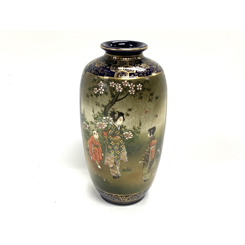 1115 - A small Japanese satsuma pottery vase with blue ground, with 2 hand painted traditional scenes.