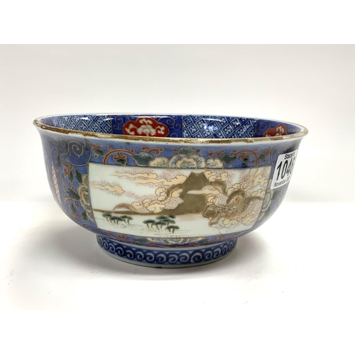 1126 - A Japanese Imari bowl, 19th century, decorated with scenes of Mount Fuji and Dragons. 22cm x 10.5cm.... 