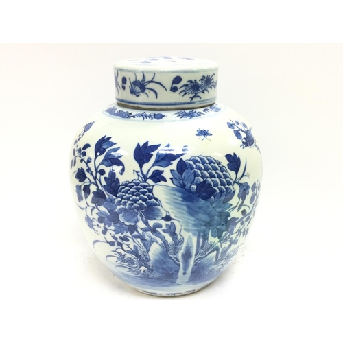 1127 - A 19th century Chinese blue and white ginger tea jar decorated with birds and flowers. Approximately... 