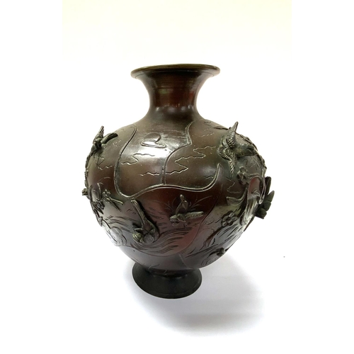 1138 - A Japanese Meiji period bronze squat form vase with raised relief bird decoration. H.25cm. (C)