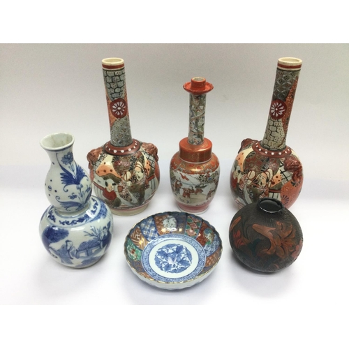 1159 - A box of Oriental ceramics comprising mainly vases and dishes. Shipping category D.