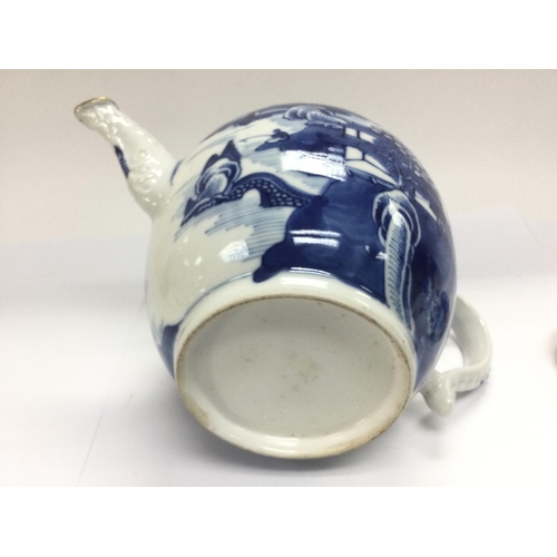 1160 - An 18th Century Chinese blue and white teapot decorated with pagodas. Shipping category D.