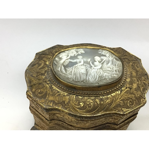 903 - A vintage trinket box inset with a cameo. 14cm wide and 12cm tall.Postage B