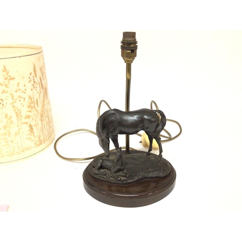 904 - A bronze lamp with horse and foal. Approximately 35cm high and 23cm wide. Postage C.- NO RESERVE