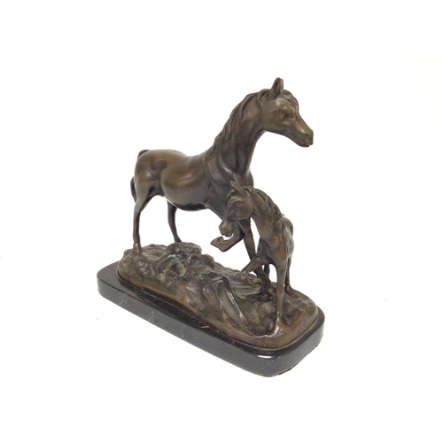 905 - A bronze horse and foal. 24cm wide and 22cm tall. Postage B- NO RESERVE