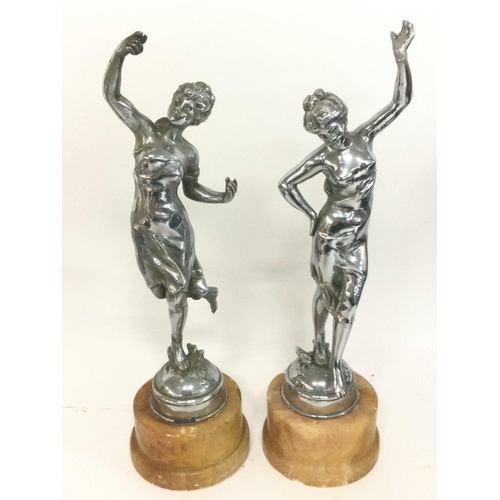 906 - A pair of chrome Art Deco figures,mounted on marbles bases. Approximately 34cm tall. Postage categor... 