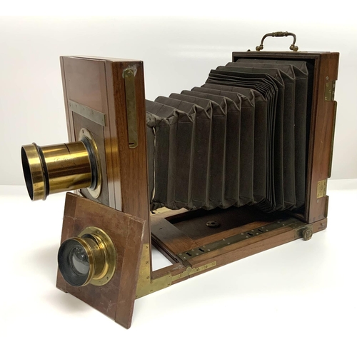 908 - A Mahogany folding plate camera with 2 detachable lenses. 1 Marked E.Francais, Paris 16738 / E.Franc... 