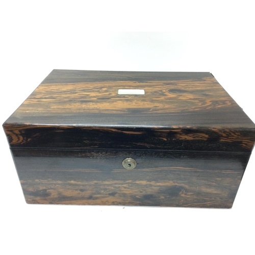 911 - A Coromandel writing slope box, with a Bramah locking system. Approximate dimensions 25x36x16cm. Pos... 