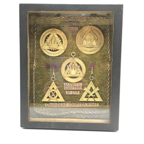 919 - A glazed display case containing five various Masonic medallions from Domatic and Crusaders chapters... 