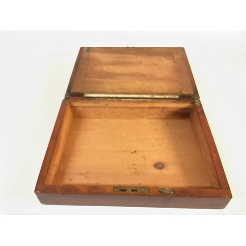 925 - A mahogany writing slope / chest. 30cm wide by 22cm deep. Postage B