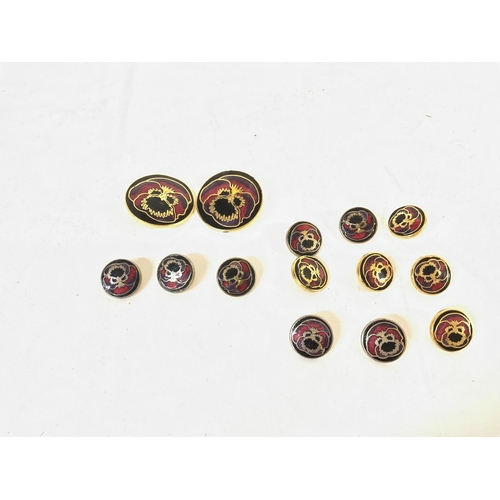 926 - A set of enamelled buttons. Two larger ones are 25mm and smaller ones are 13mm. Postage A