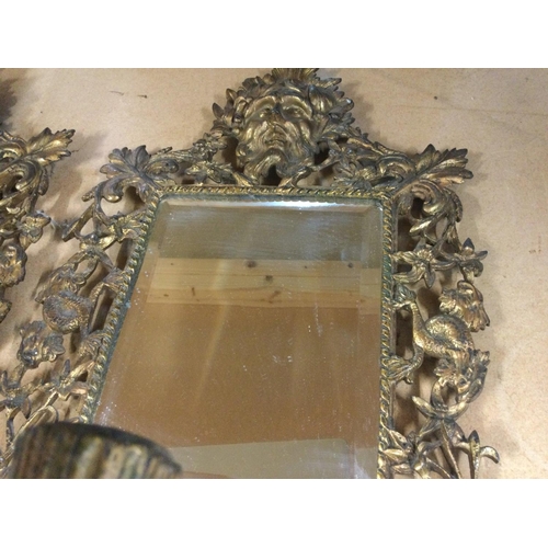 933 - A pair of gilt metal wall mirrors of classical style with three branch candelabra 44 cm 25 cm .