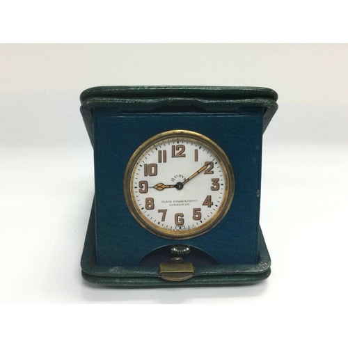 934 - A vintage 8 day travelling clock. Shipping category A.