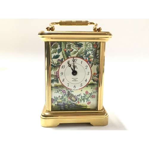 935 - A small brass carriage Halcyon Days Enamels clock. Postage category D