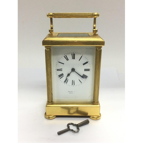 947 - A brass cased carriage clock with key. Shipping category D.