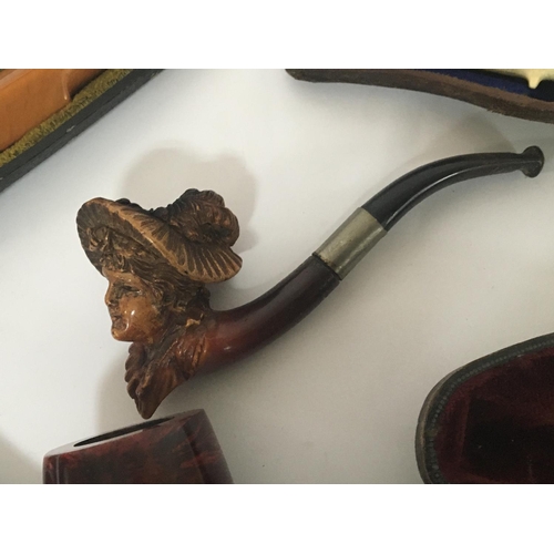 948 - A collection of Meerchaum and other vintage tobacco pipes.