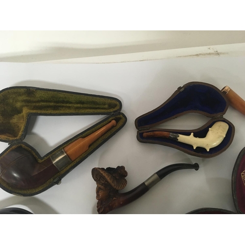 948 - A collection of Meerchaum and other vintage tobacco pipes.