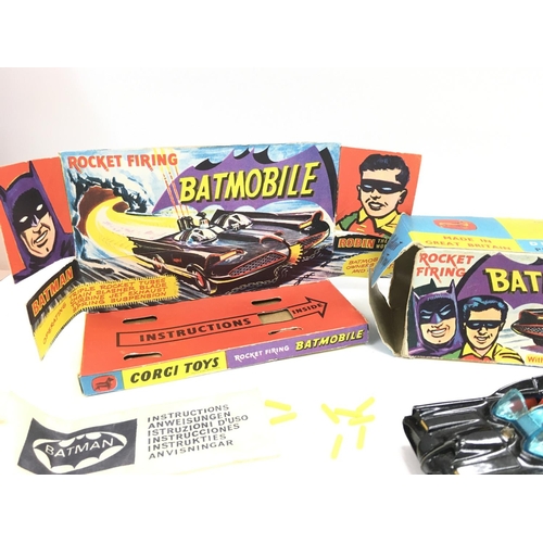 107 - A Boxed Corgi Batmobile #267. Box is worn. Original rockets and sticker Missing.