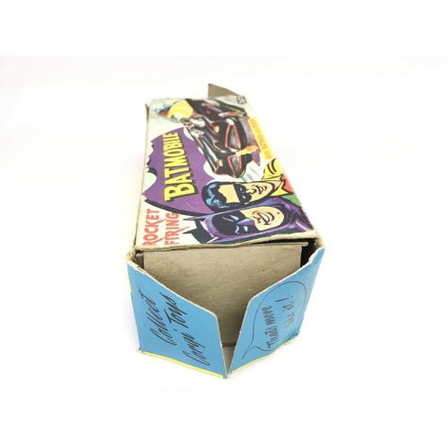 107 - A Boxed Corgi Batmobile #267. Box is worn. Original rockets and sticker Missing.